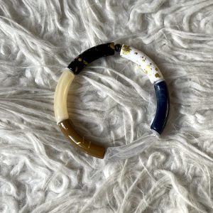 Tube armband zwart, wit, crème, bruin, doorzichtig en donkerblauw